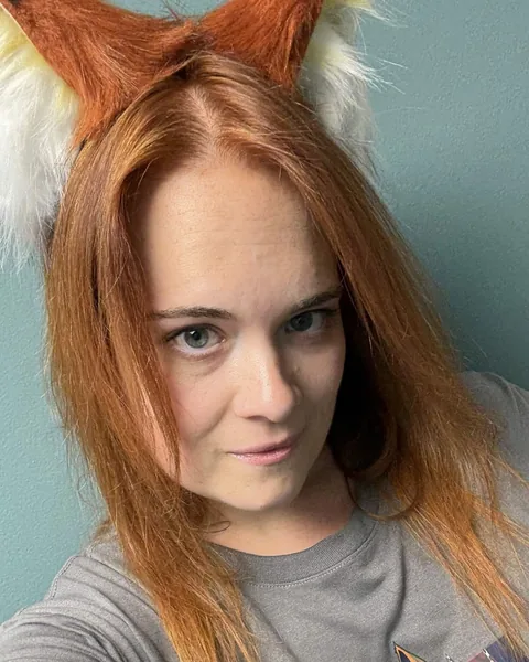 PinkFoxx wearing fox ears and a DEF CON shirt