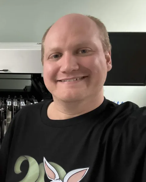 TehRabbitt smiling in a black rabbit shirt